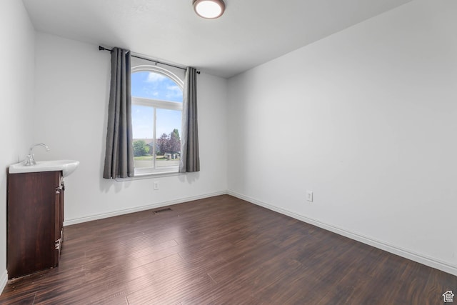 6228 S Waller Ln, West Jordan, UT 84081 - spare room with dark wood-type flooring