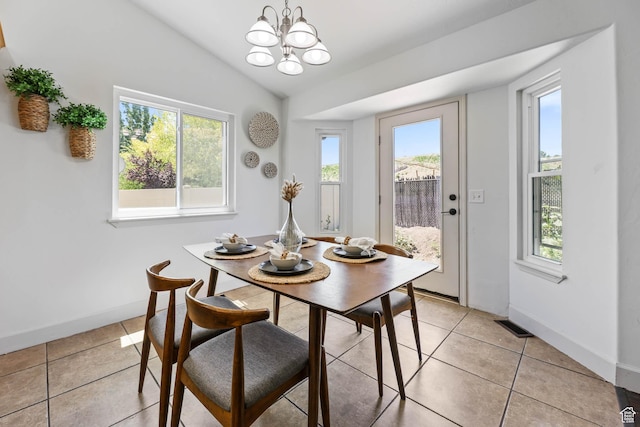 6228 S Waller Ln, West Jordan, UT 84081 - dining room with light tile patterned flooring, a chandelier, and lofted ceiling