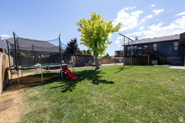 1663 W 2500 N, Vernal, UT 84078 - fenced backyard featuring a trampoline, stairway, and a wooden deck