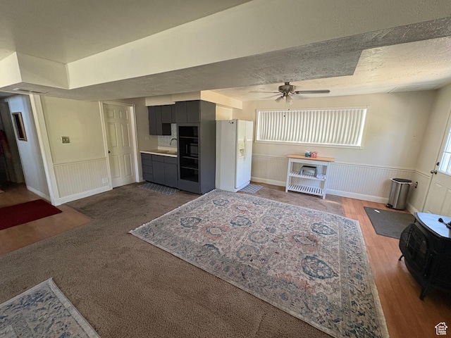 4208 S 4205 W, West Valley City, UT 84120 - living area featuring ceiling fan, wainscoting, and wood finished floors