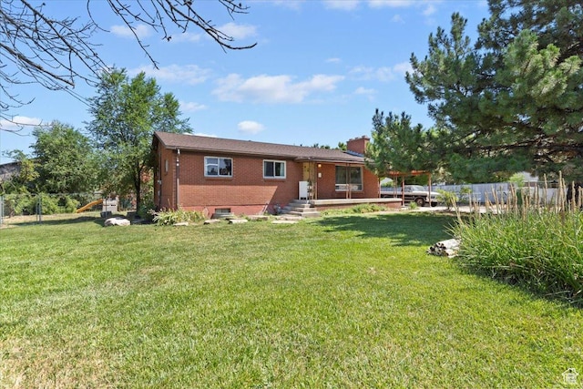2262 W 2300 N, Clinton, UT 84015 - back of house featuring brick siding and a chimney