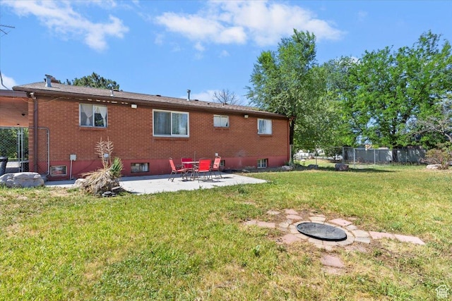 2262 W 2300 N, Clinton, UT 84015 - rear view of property featuring a patio and brick siding