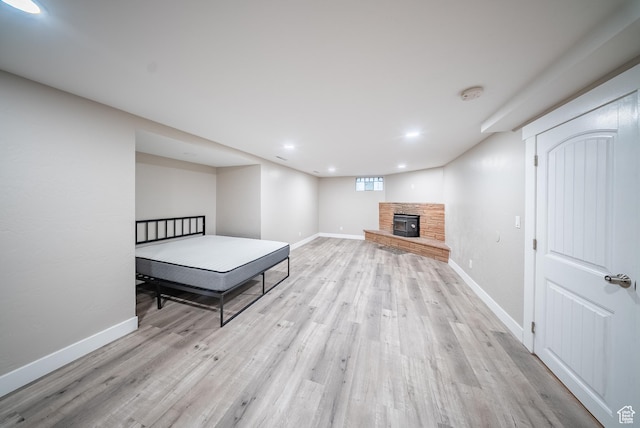 252 E 1000 N, Logan, UT 84321 - bedroom featuring light wood-style floors, a fireplace, and recessed lighting
