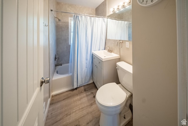 252 E 1000 N, Logan, UT 84321 - full bathroom featuring wood finished floors, vanity, and shower / bath combo with shower curtain