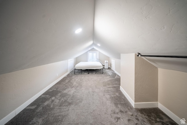 252 E 1000 N, Logan, UT 84321 - carpeted bedroom with lofted ceiling and a textured wall