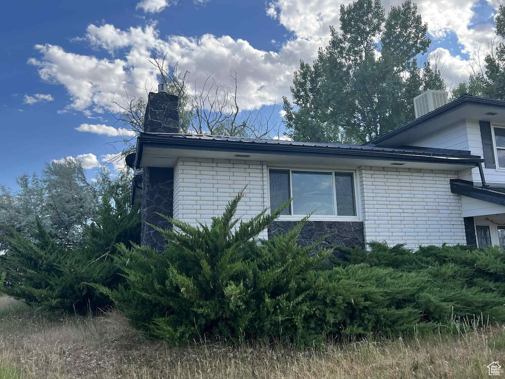 736 E 1500 N, Vernal, UT 84078 - view of property exterior featuring a chimney and brick siding
