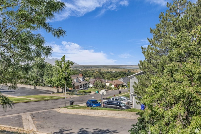 1834 N 200 E, Centerville, UT 84014 - view of asphalt road featuring sidewalks, street lights, curbs, and a residential view