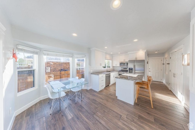 788 E 8230 S, Sandy, UT 84094 - kitchen featuring stainless steel appliances, dark wood-style flooring, white cabinetry, healthy amount of natural light, and recessed lighting