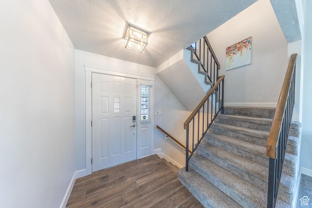 788 E 8230 S, Sandy, UT 84094 - foyer featuring stairs, wood finished floors, and a textured ceiling