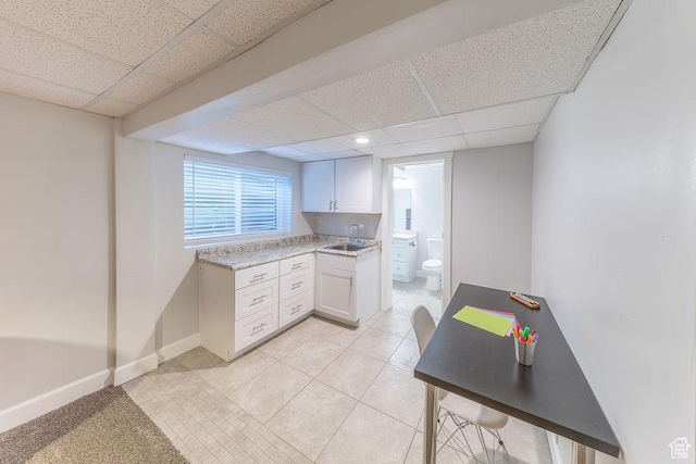 788 E 8230 S, Sandy, UT 84094 - kitchen featuring a drop ceiling, light countertops, white cabinetry, and light tile patterned floors