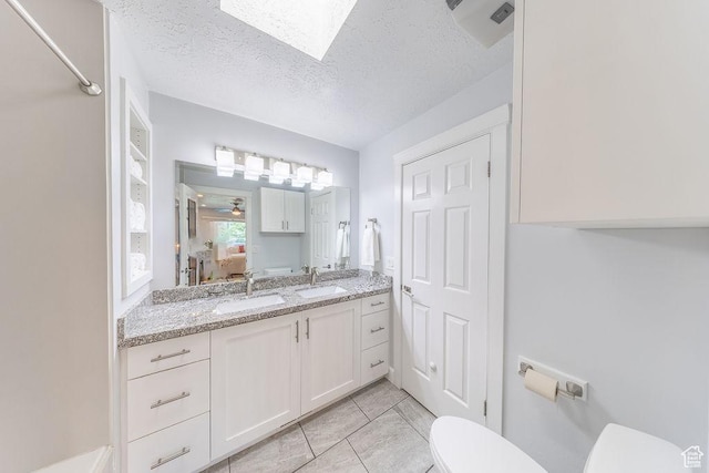 788 E 8230 S, Sandy, UT 84094 - bathroom featuring vanity, a textured ceiling, ceiling fan, and a skylight