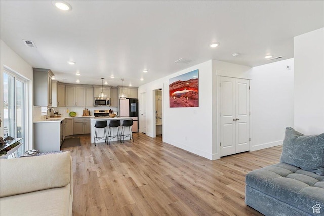 3380 W 3275 N, Plain City, UT 84404 - living room featuring light wood finished floors and recessed lighting