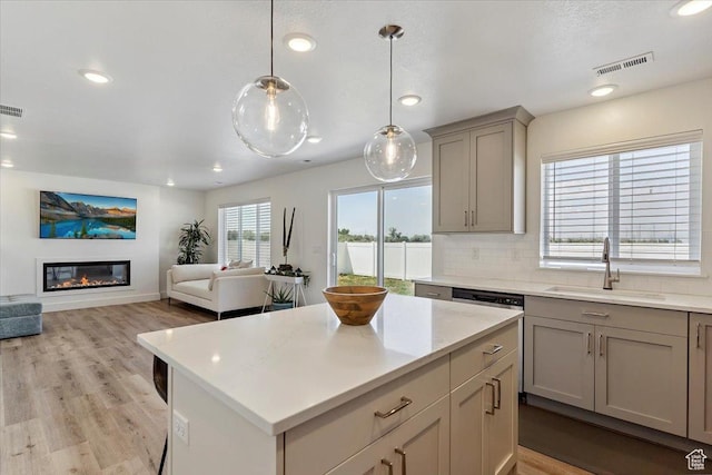 3380 W 3275 N, Plain City, UT 84404 - kitchen featuring gray cabinets, light countertops, recessed lighting, decorative backsplash, and a center island