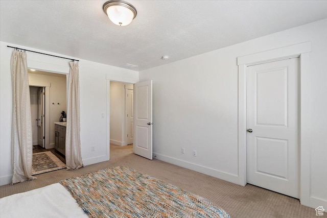 3380 W 3275 N, Plain City, UT 84404 - unfurnished bedroom featuring light colored carpet, a textured ceiling, and ensuite bath