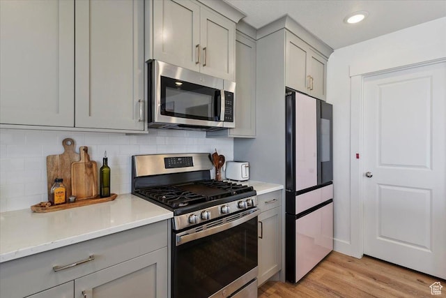3380 W 3275 N, Plain City, UT 84404 - kitchen with stainless steel appliances, gray cabinetry, and light countertops