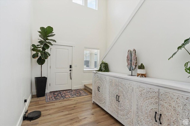 3380 W 3275 N, Plain City, UT 84404 - entryway featuring light wood-style flooring and a high ceiling