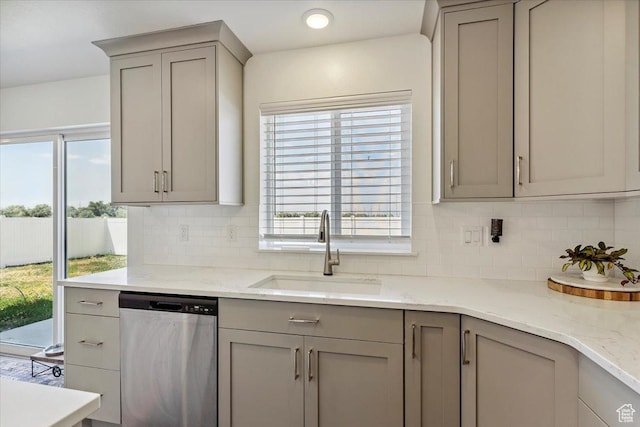 3380 W 3275 N, Plain City, UT 84404 - kitchen featuring stainless steel dishwasher, gray cabinets, decorative backsplash, and light stone countertops