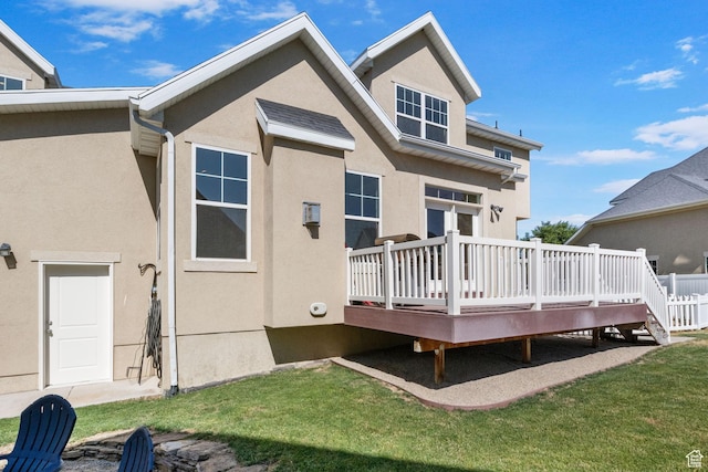 889 S Sego Lily Way, Mapleton, UT 84664 - rear view of property featuring stucco siding, a wooden deck, and a lawn