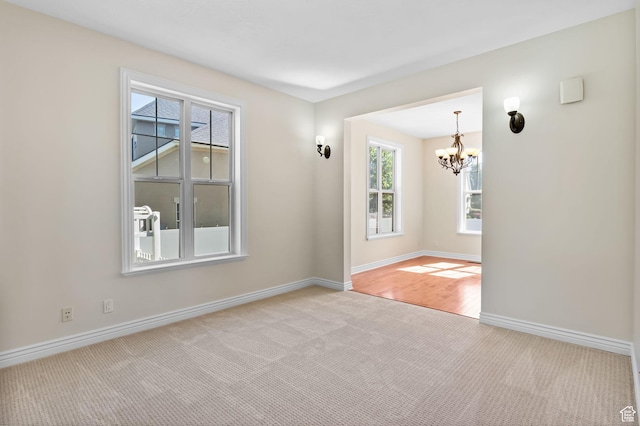 889 S Sego Lily Way, Mapleton, UT 84664 - spare room with light carpet and a chandelier