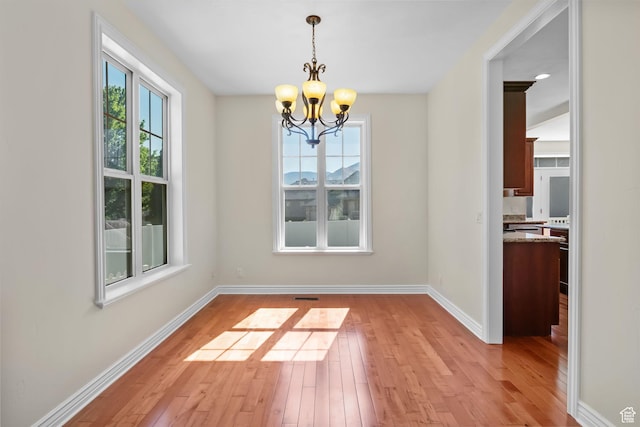 889 S Sego Lily Way, Mapleton, UT 84664 - unfurnished dining area featuring a chandelier and light wood finished floors