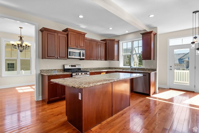 889 S Sego Lily Way, Mapleton, UT 84664 - kitchen featuring appliances with stainless steel finishes, light wood-style floors, a chandelier, a center island, and recessed lighting