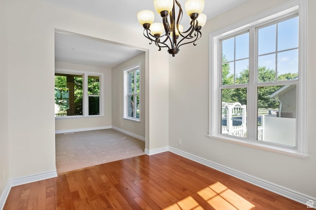 889 S Sego Lily Way, Mapleton, UT 84664 - empty room with a chandelier and hardwood / wood-style flooring