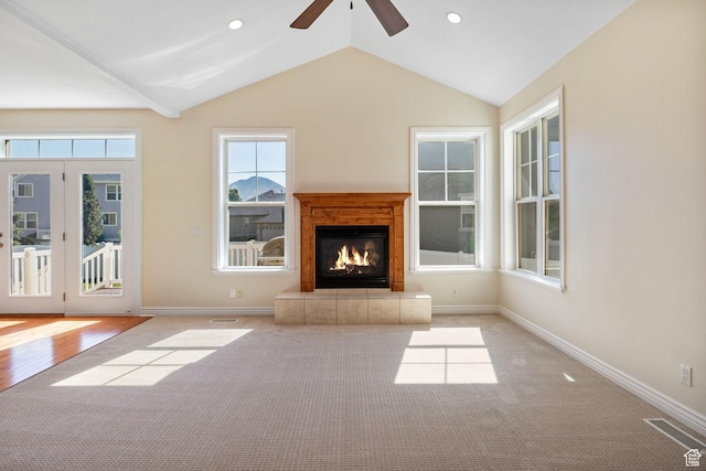 889 S Sego Lily Way, Mapleton, UT 84664 - unfurnished living room featuring carpet, a ceiling fan, a tile fireplace, vaulted ceiling, and recessed lighting
