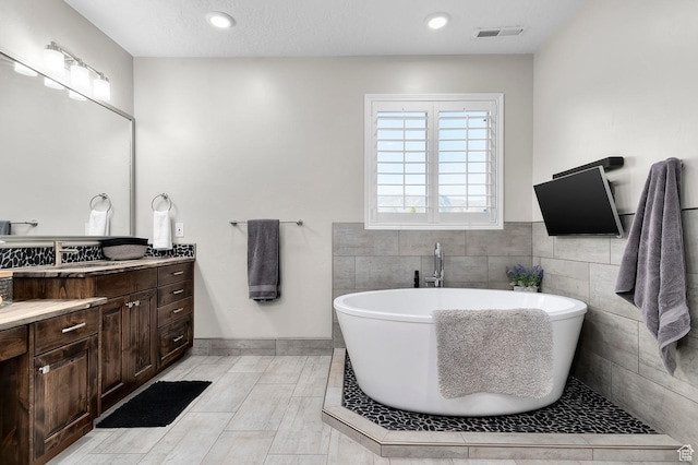 292 E Clubview Ln, Lehi, UT 84043 - bathroom with vanity, a freestanding tub, and recessed lighting