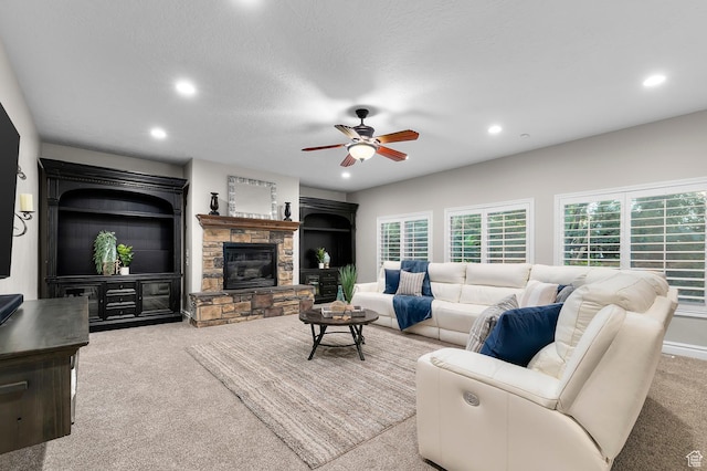 292 E Clubview Ln, Lehi, UT 84043 - living room with recessed lighting, ceiling fan, carpet floors, a stone fireplace, and a textured ceiling