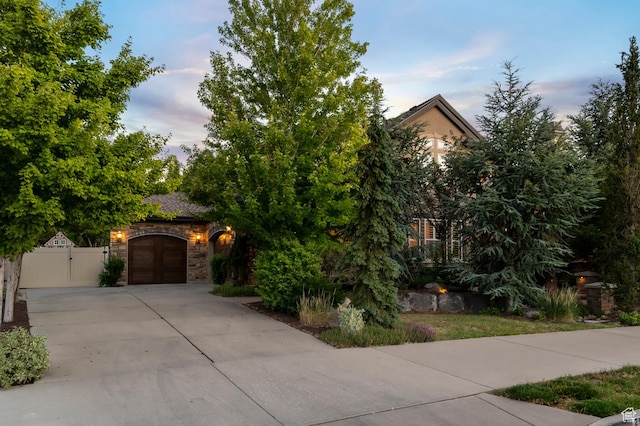 292 E Clubview Ln, Lehi, UT 84043 - obstructed view of property with concrete driveway, a gate, a garage, and stone siding