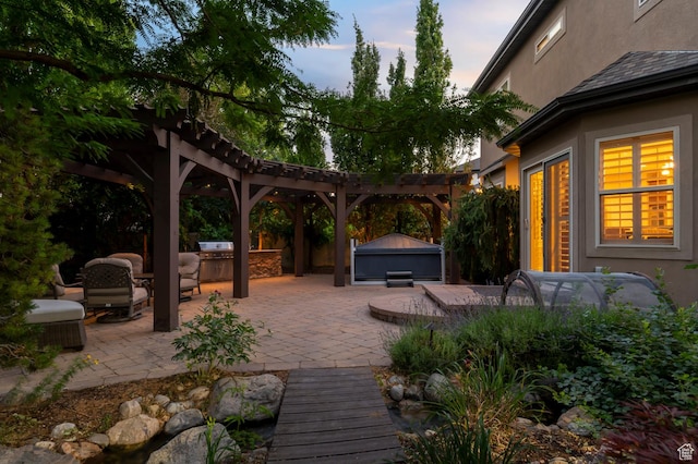 292 E Clubview Ln, Lehi, UT 84043 - patio terrace at dusk featuring a patio area, a pergola, a jacuzzi, and an outdoor kitchen