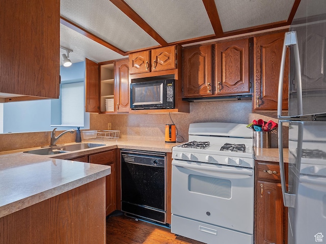 4525 S Taylor Ave E, Ogden, UT 84403 - kitchen featuring black appliances, wood finished floors, light countertops, brown cabinets, and open shelves