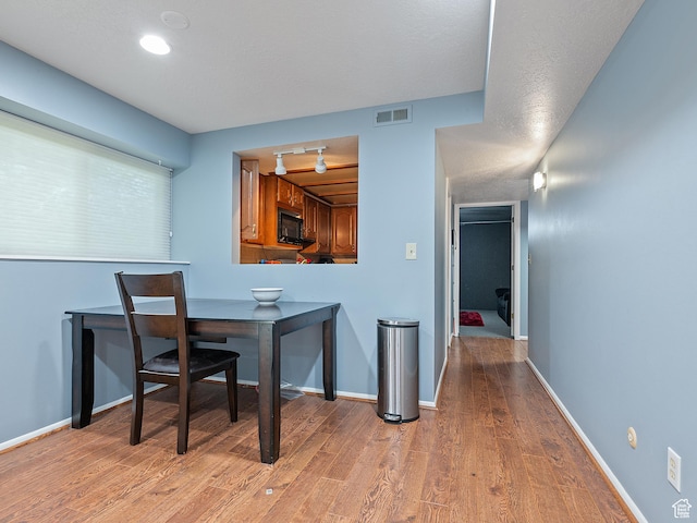 4525 S Taylor Ave E, Ogden, UT 84403 - dining area featuring light wood-style flooring and baseboards