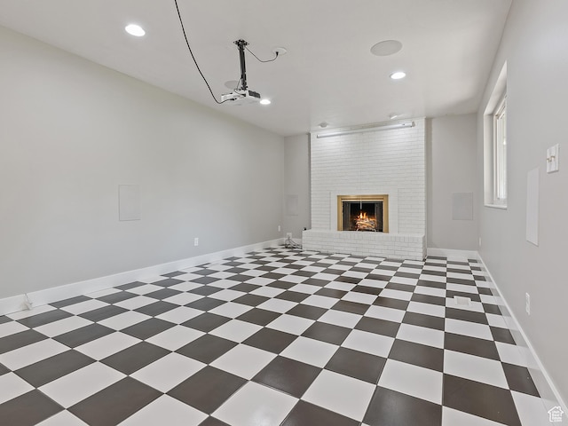 4525 S Taylor Ave E, Ogden, UT 84403 - unfurnished living room featuring recessed lighting and a brick fireplace