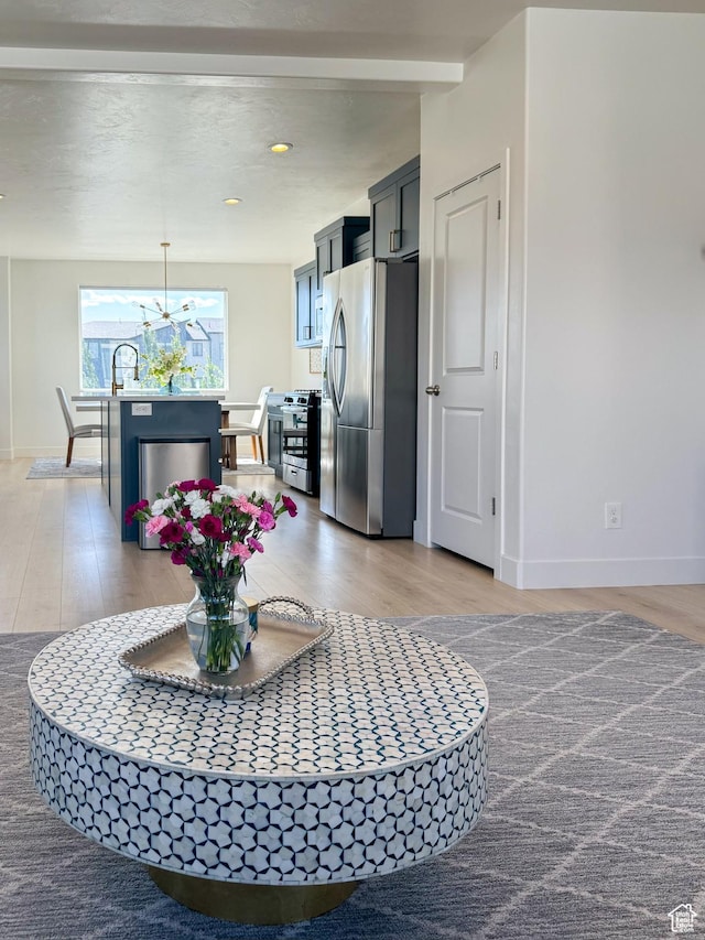 457 S Wood Stream Rd, American Fork, UT 84003 - kitchen with appliances with stainless steel finishes, light wood-type flooring, a chandelier, and decorative light fixtures