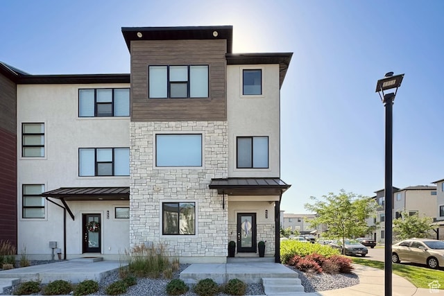 457 S Wood Stream Rd, American Fork, UT 84003 - contemporary house with a standing seam roof, stucco siding, and a metal roof