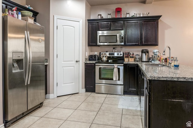 373 E 535 S, Vernal, UT 84078 - kitchen featuring stainless steel appliances, light stone counters, a peninsula, and light tile patterned floors
