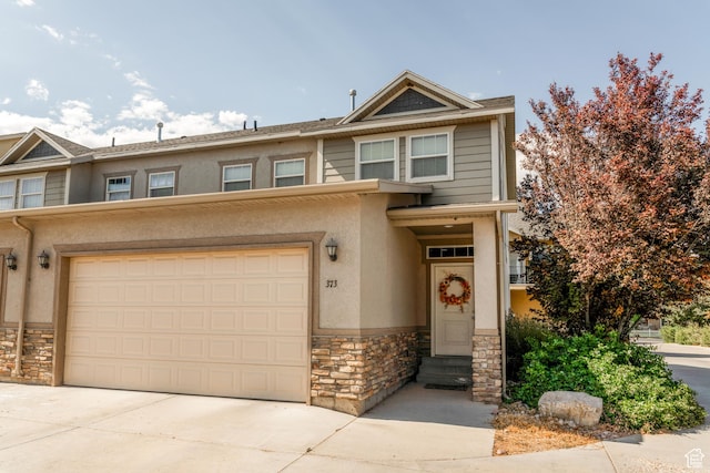 373 E 535 S, Vernal, UT 84078 - traditional home featuring stone siding, driveway, stucco siding, entry steps, and an attached garage