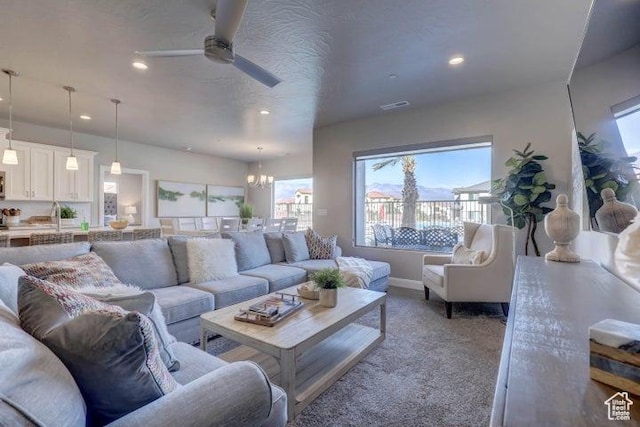 259 N 2020 W, Hurricane, UT 84737 - living room with ceiling fan, recessed lighting, a chandelier, and carpet