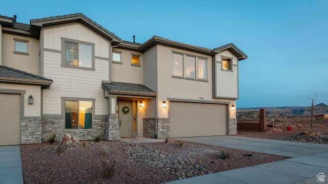 259 N 2020 W, Hurricane, UT 84737 - view of front of home featuring stone siding, a garage, and driveway