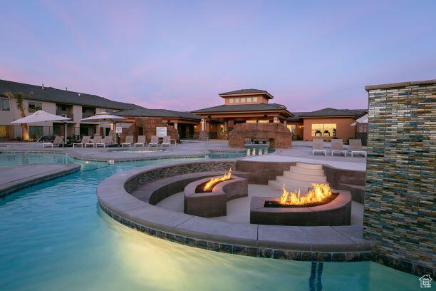 259 N 2020 W, Hurricane, UT 84737 - pool at dusk featuring a fire pit, a gazebo, a community pool, and a patio