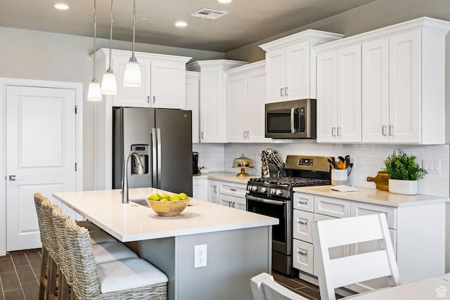 259 N 2020 W, Hurricane, UT 84737 - kitchen with stainless steel appliances, recessed lighting, decorative backsplash, white cabinetry, and pendant lighting