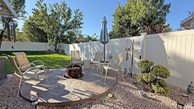 11766 S Hidden Valley Rd E, Sandy, UT 84092 - fenced backyard featuring a patio area and a fire pit