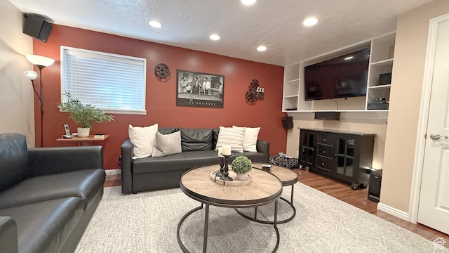 11766 S Hidden Valley Rd E, Sandy, UT 84092 - living room with recessed lighting, wood finished floors, and a textured ceiling