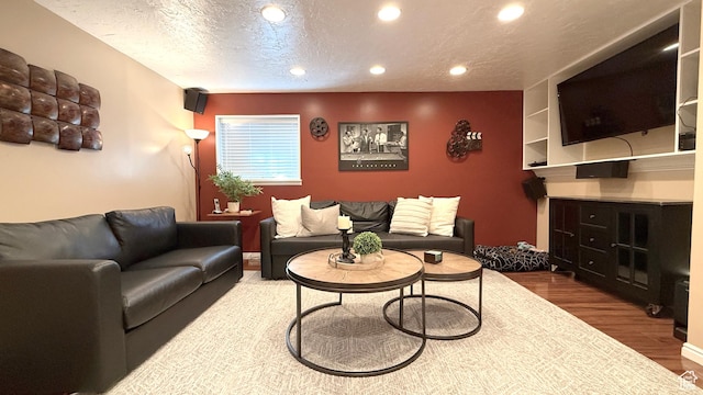 11766 S Hidden Valley Rd E, Sandy, UT 84092 - living area featuring wood finished floors, recessed lighting, and a textured ceiling