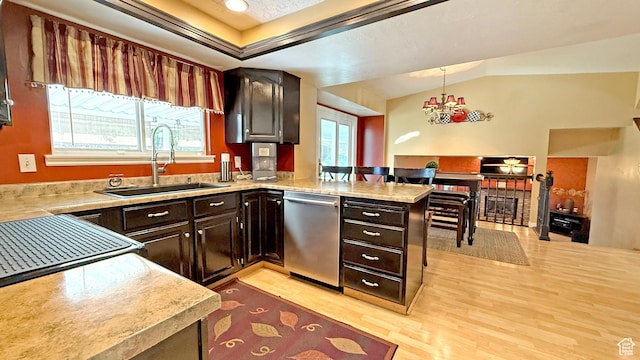 11766 S Hidden Valley Rd E, Sandy, UT 84092 - kitchen featuring stainless steel dishwasher, light countertops, light wood-style floors, a peninsula, and a chandelier