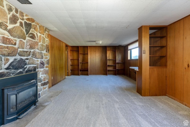 869 N 1600 E, Preston, ID 83263 - unfurnished living room with wooden walls, carpet floors, and built in features