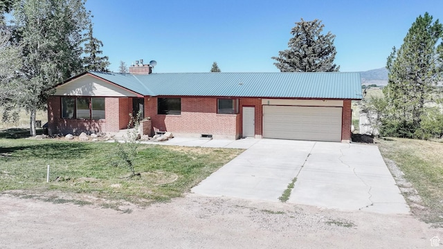 869 N 1600 E, Preston, ID 83263 - ranch-style home featuring an attached garage, driveway, a front lawn, and a metal roof