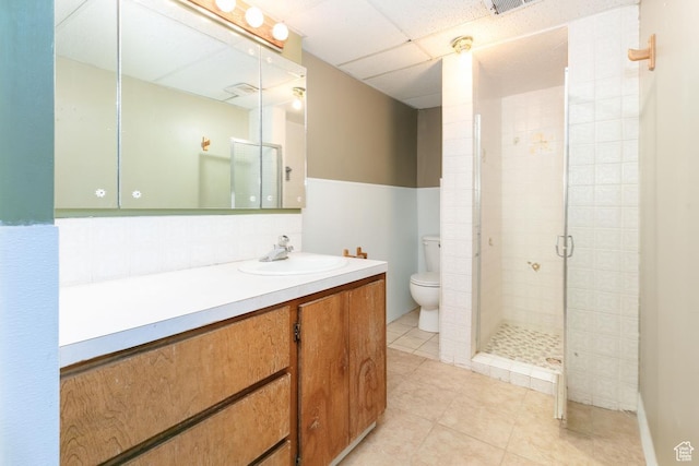869 N 1600 E, Preston, ID 83263 - bathroom featuring vanity, a shower stall, tile patterned floors, and a paneled ceiling