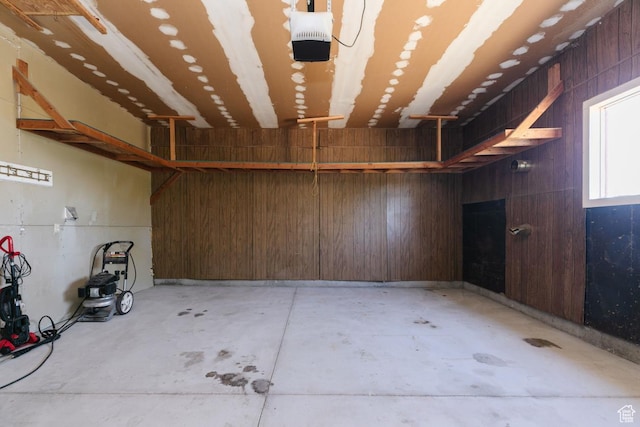 869 N 1600 E, Preston, ID 83263 - garage featuring a garage door opener and wood walls